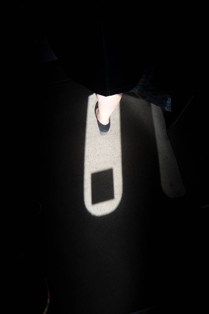 A foot in a block of shadow